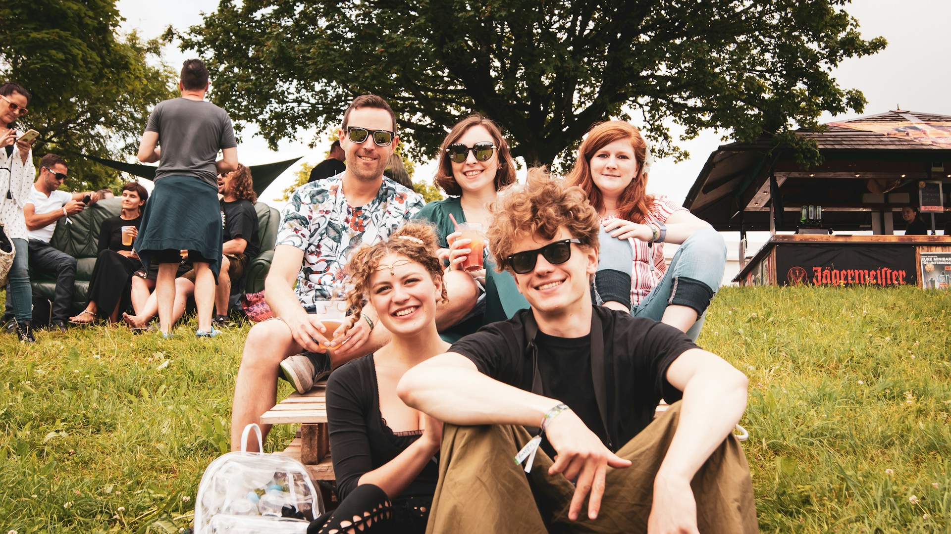 Families enjoying an outdoor music festival similar to Latitude Festival family-friendly daytime areas